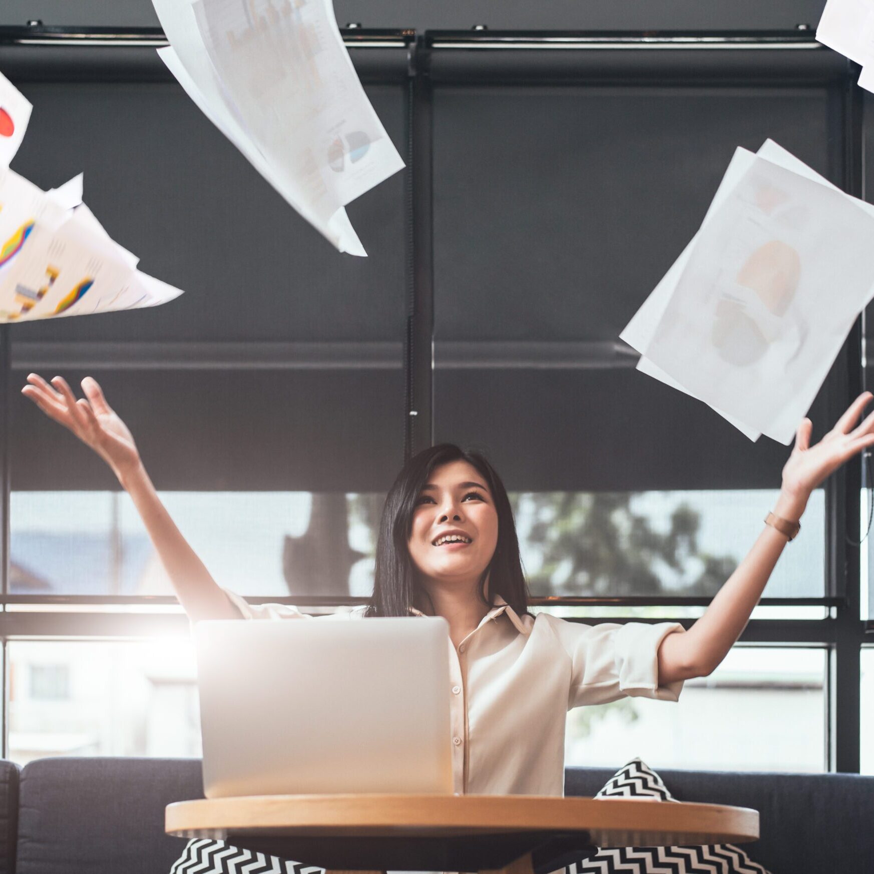Businesswoman Throwing Paperwork Into The Air. Succ businesswoman throwing paperwork into the air. Successful and achievement concept. Business and Occupation concept. Freelance and business owner theme.